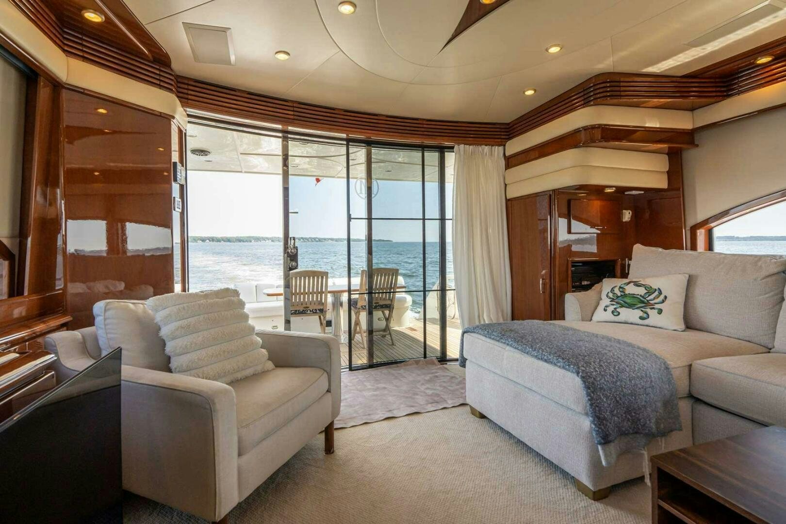 a living room with a staircase aboard NAVETTE Yacht for Sale