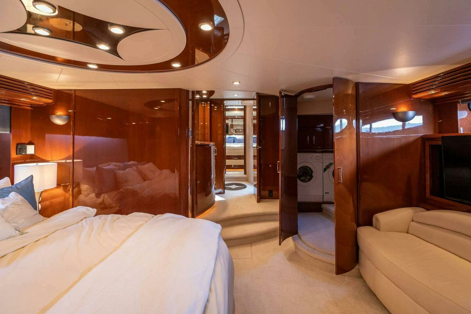a hotel room with a bed and a large mirror aboard NAVETTE Yacht for Sale