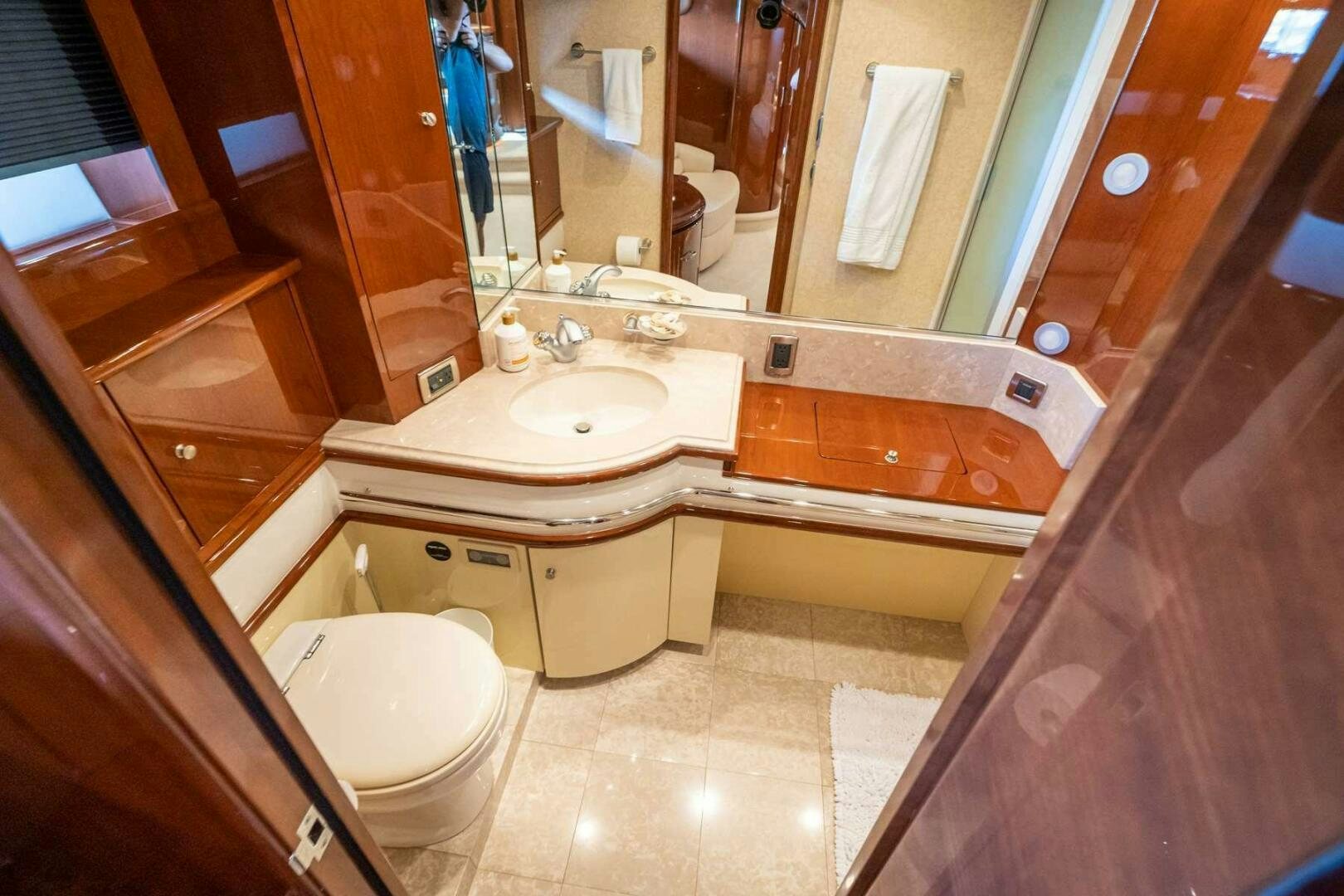 a bathroom with a tub sink and toilet aboard NAVETTE Yacht for Sale