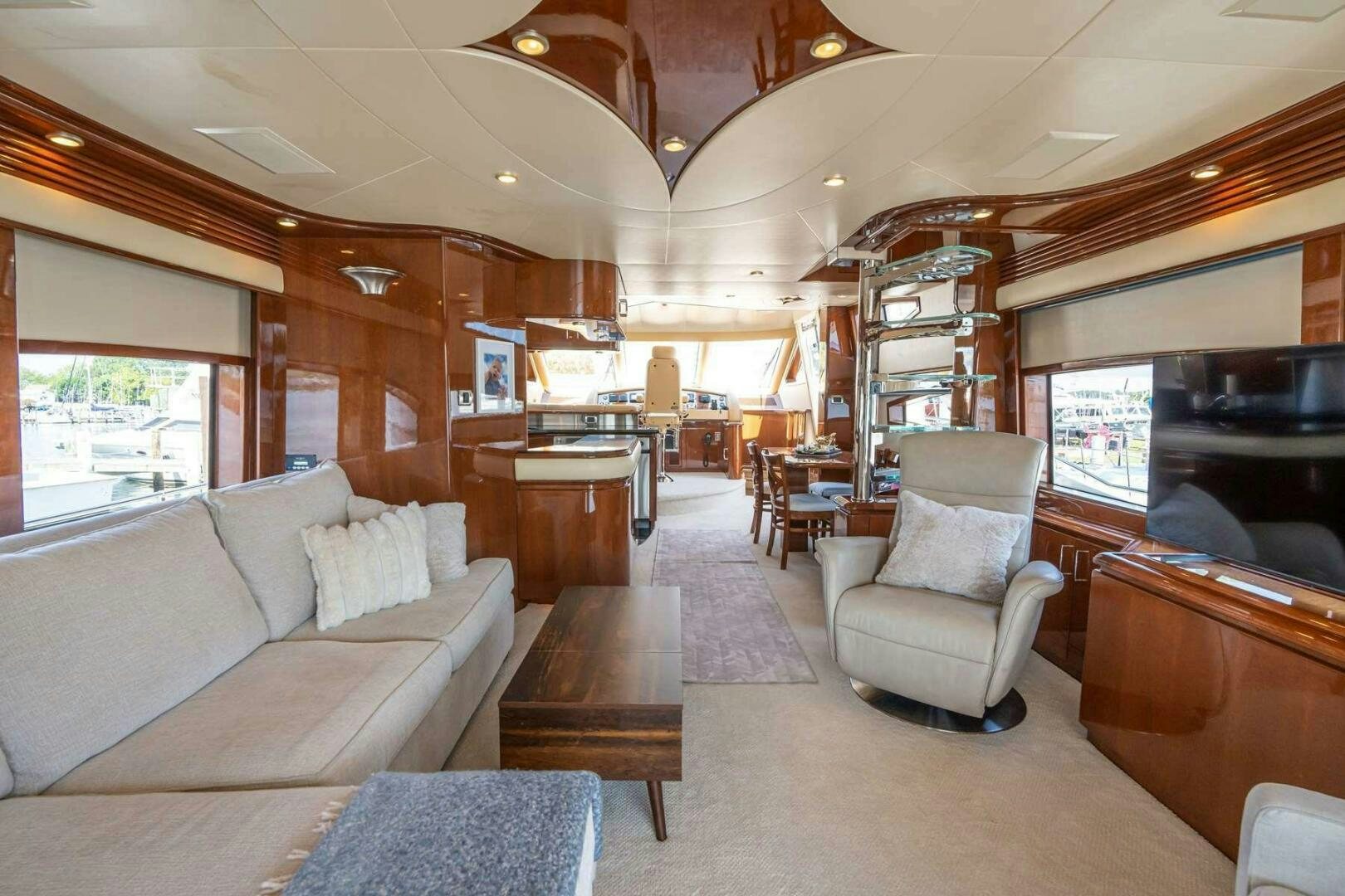 a living room with a couch and a table aboard NAVETTE Yacht for Sale