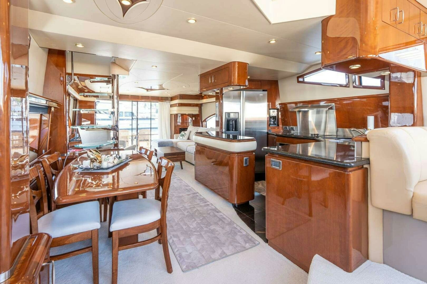 a kitchen with a dining table aboard NAVETTE Yacht for Sale