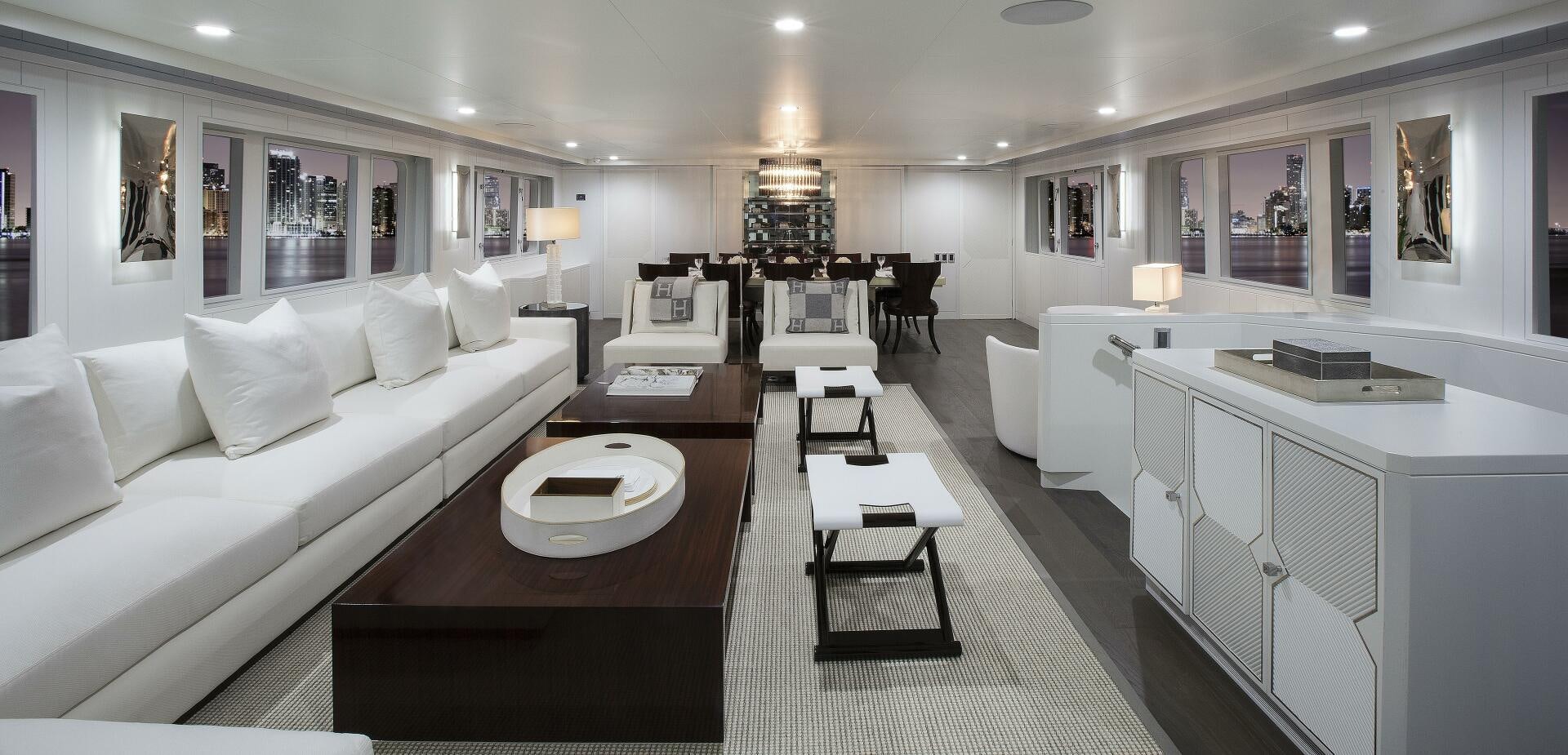 a large living room with a white couch and a table aboard BG Yacht for Sale
