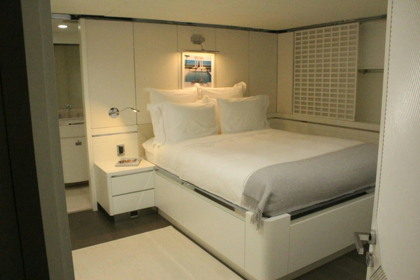 a bed in a room aboard BG Yacht for Sale