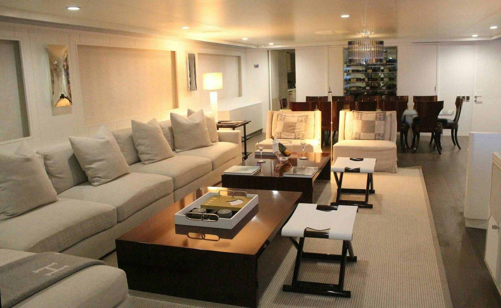 a living room with a couch and coffee table aboard BG Yacht for Sale