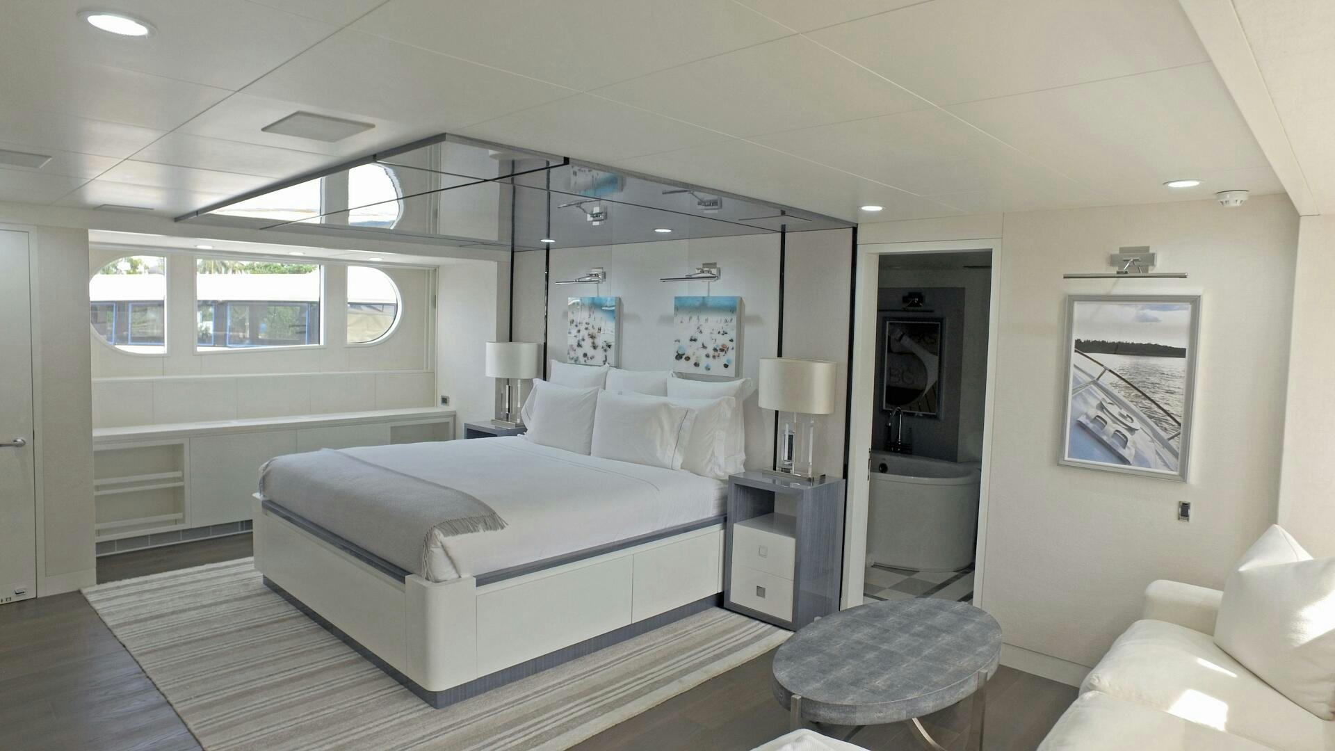 a bedroom with a large bed aboard BG Yacht for Sale