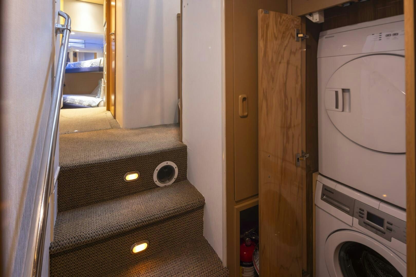 a room with a bed and a dryer aboard LISA SEA I Yacht for Sale