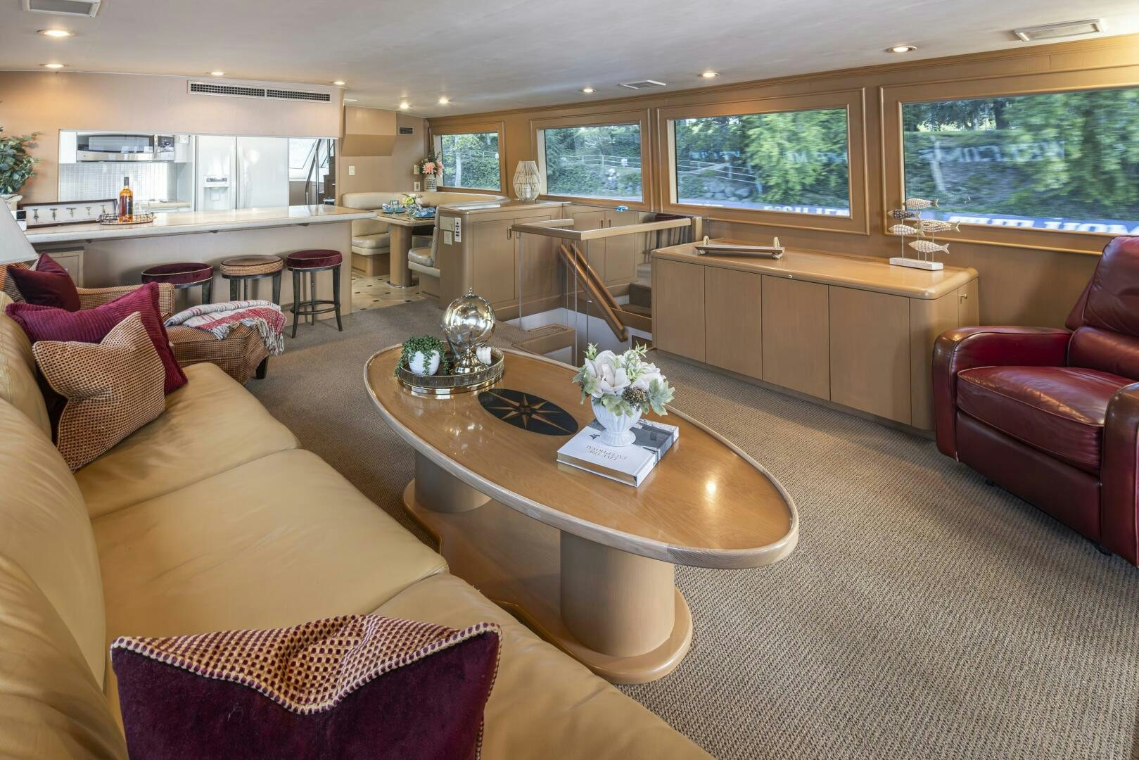 a living room with a table and chairs aboard LISA SEA I Yacht for Sale