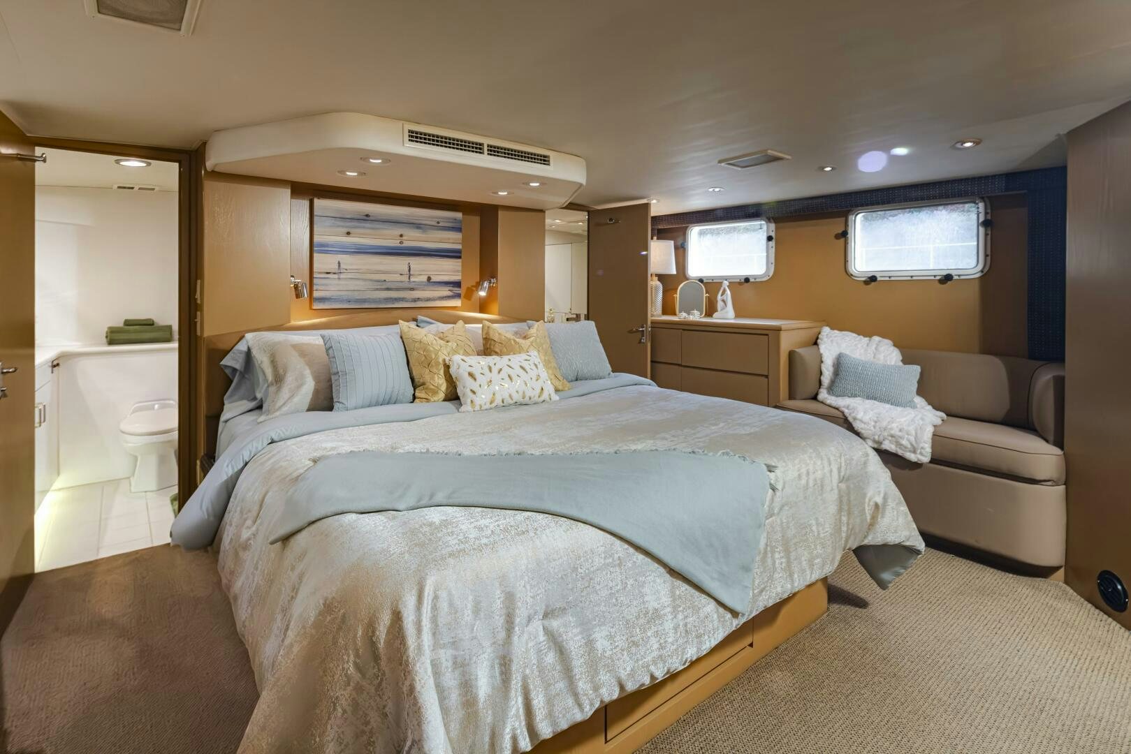 a bedroom with a bed and a couch aboard LISA SEA I Yacht for Sale