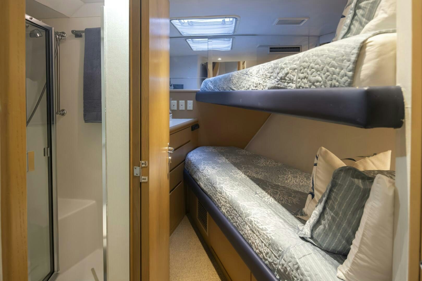 a bedroom with a bed and a closet aboard LISA SEA I Yacht for Sale