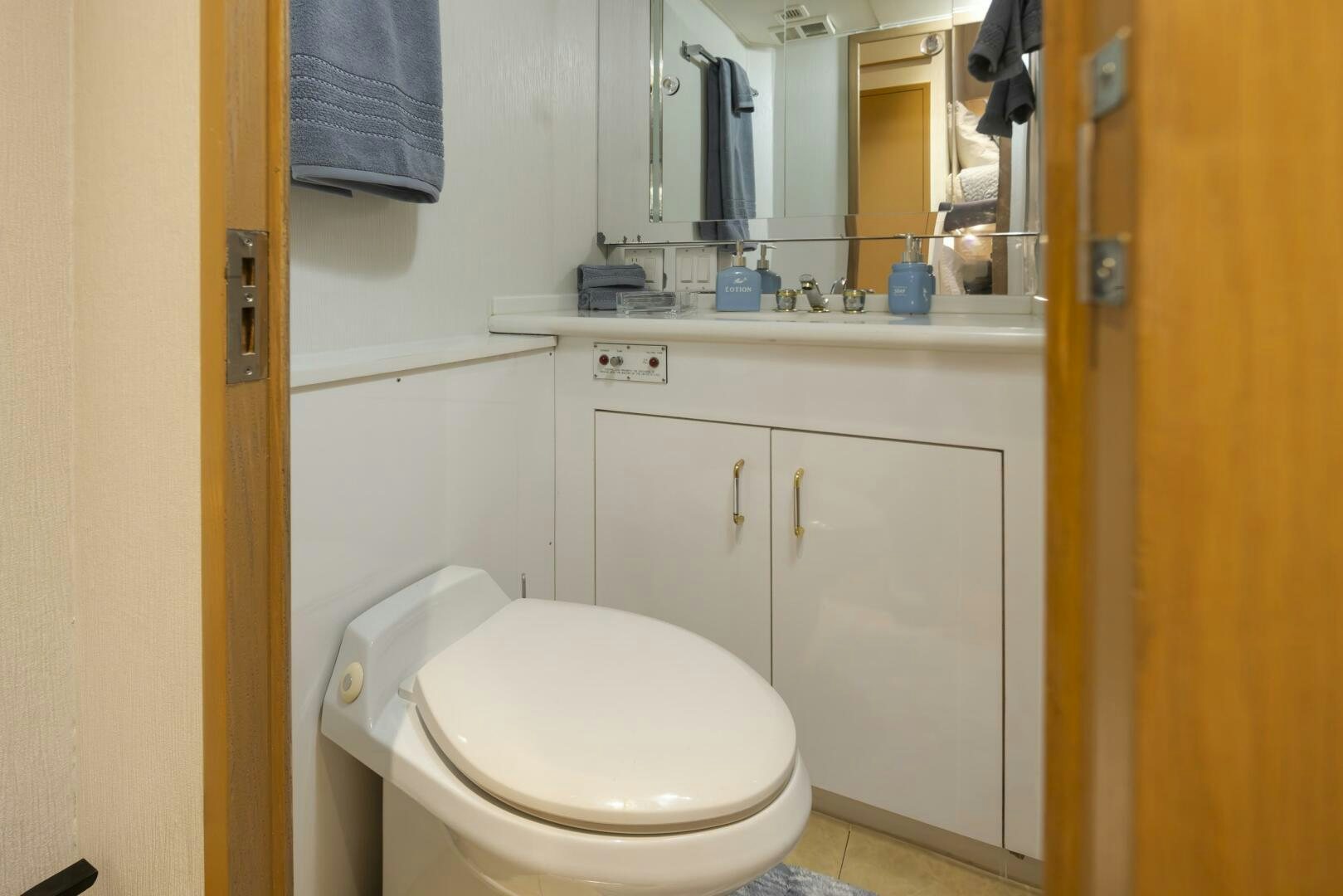 a bathroom with a toilet and a sink aboard LISA SEA I Yacht for Sale