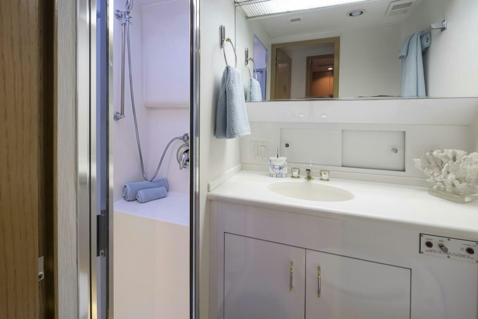 a bathroom with a sink and a mirror aboard LISA SEA I Yacht for Sale