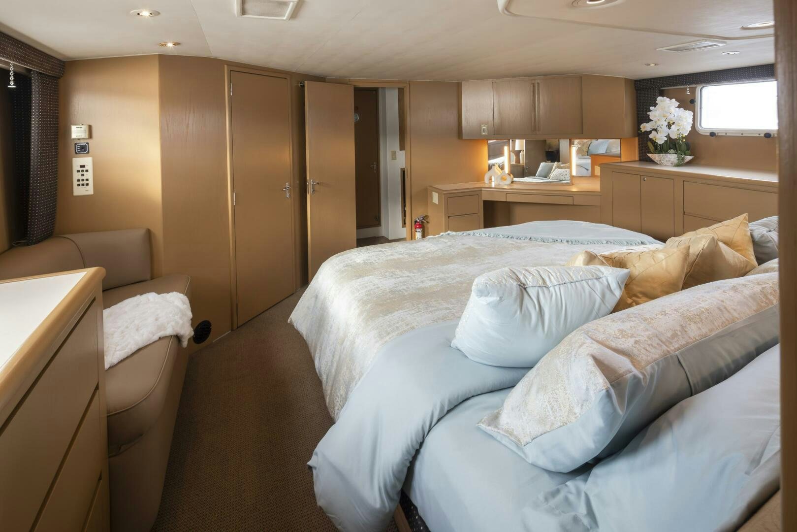 a room with a bed and a chair aboard LISA SEA I Yacht for Sale