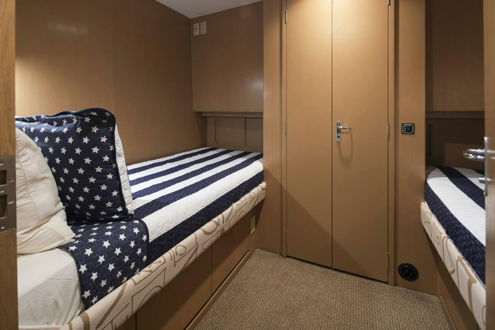 a room with a bed and a closet aboard LISA SEA I Yacht for Sale