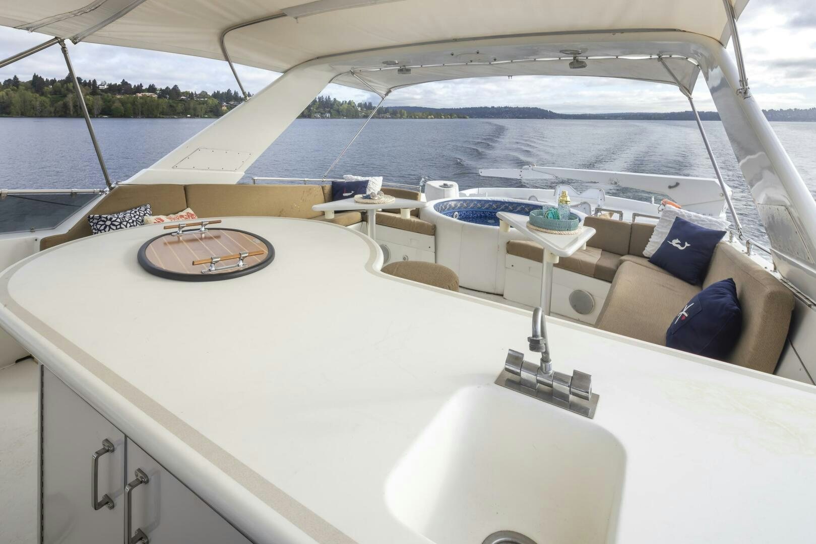 a boat with a table and chairs on the deck aboard LISA SEA I Yacht for Sale