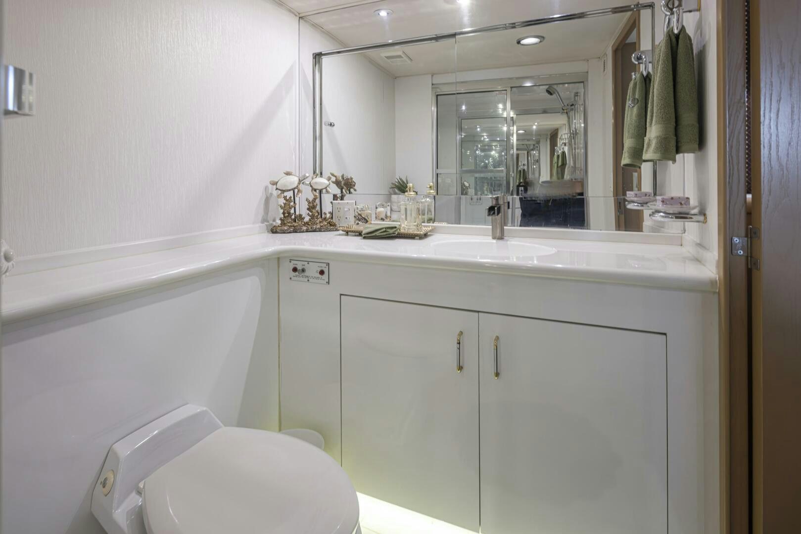 a bathroom with a large mirror aboard LISA SEA I Yacht for Sale