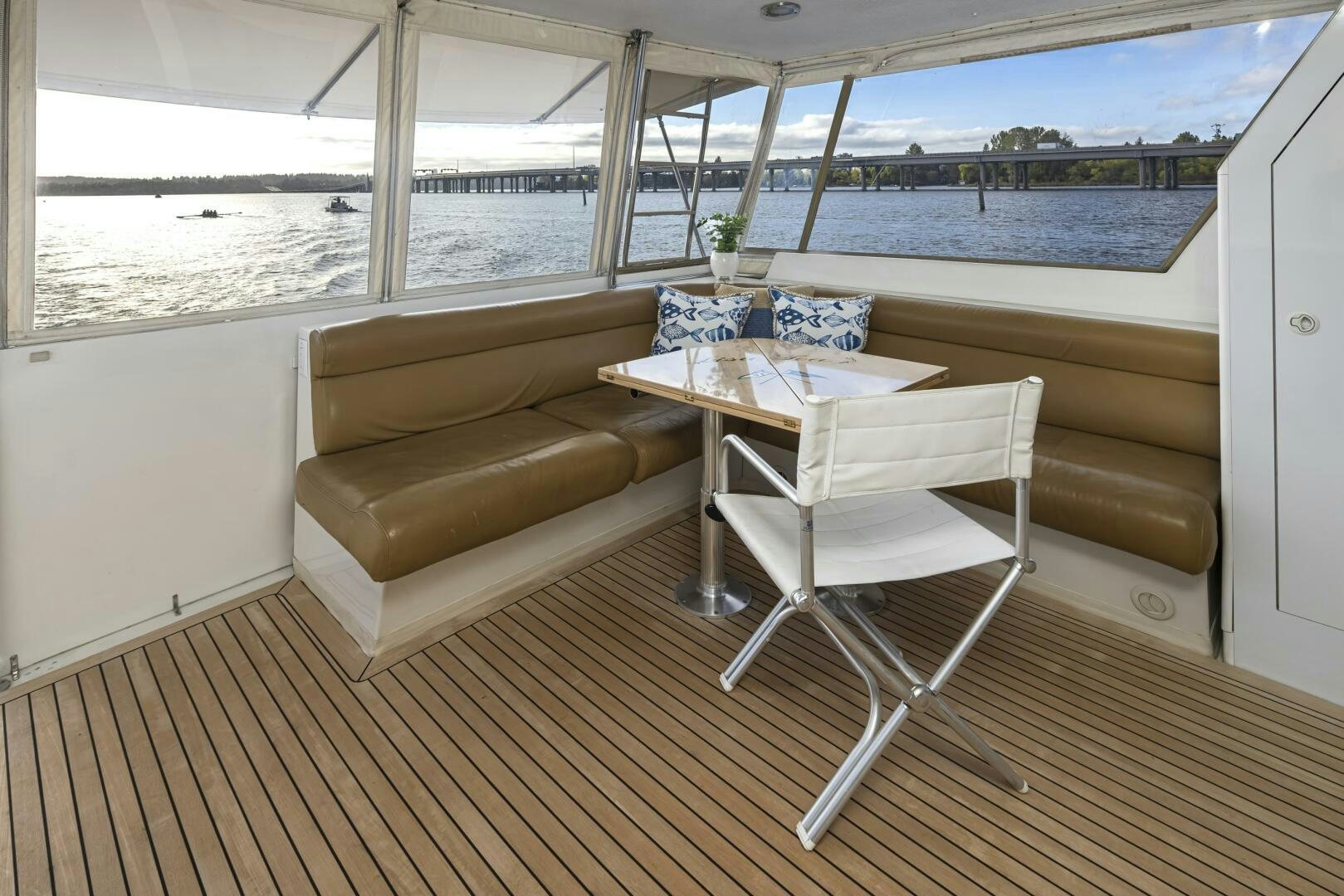 a room with a couch and a table and a chair aboard LISA SEA I Yacht for Sale