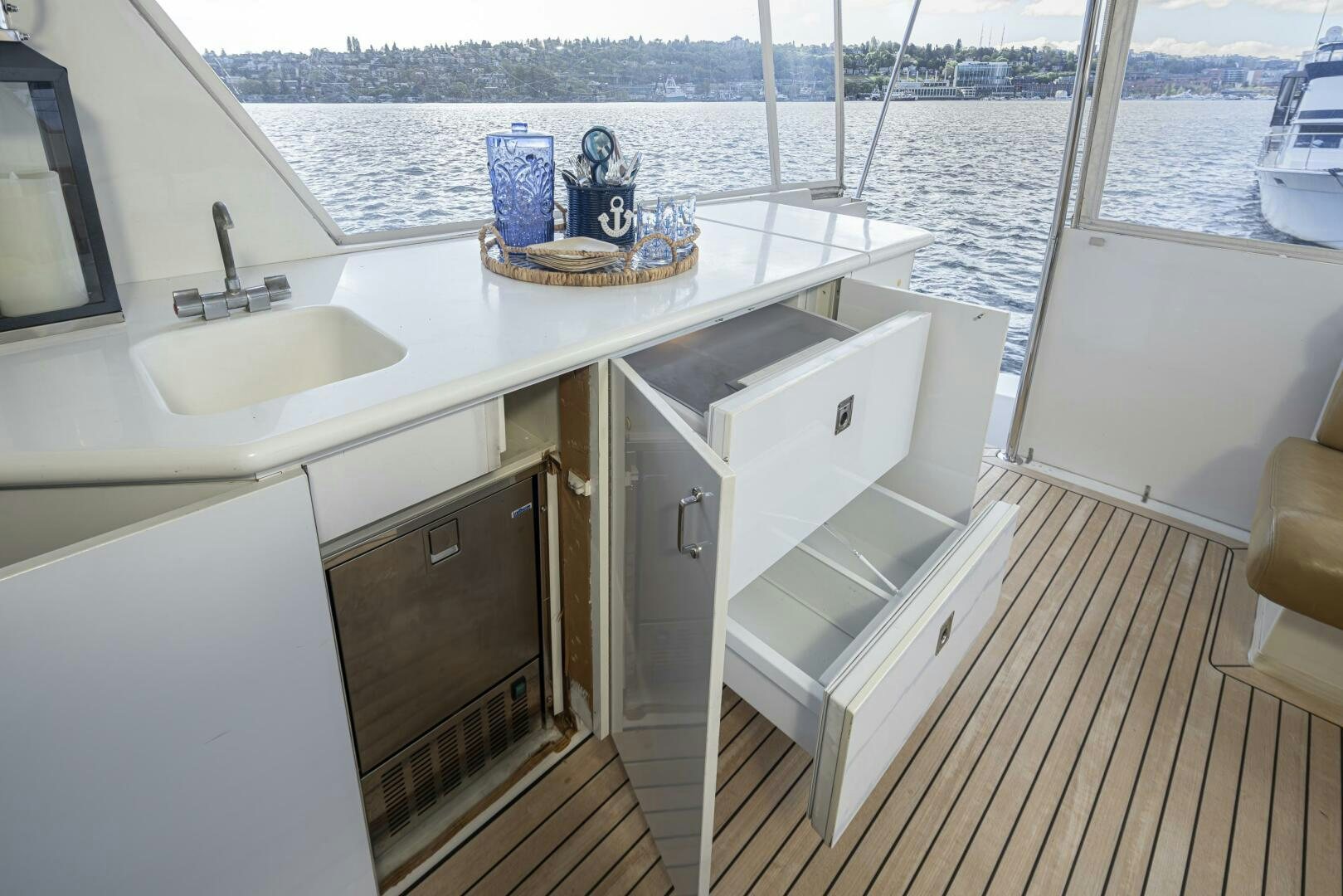 a kitchen with a sink and a window overlooking a body of water aboard LISA SEA I Yacht for Sale
