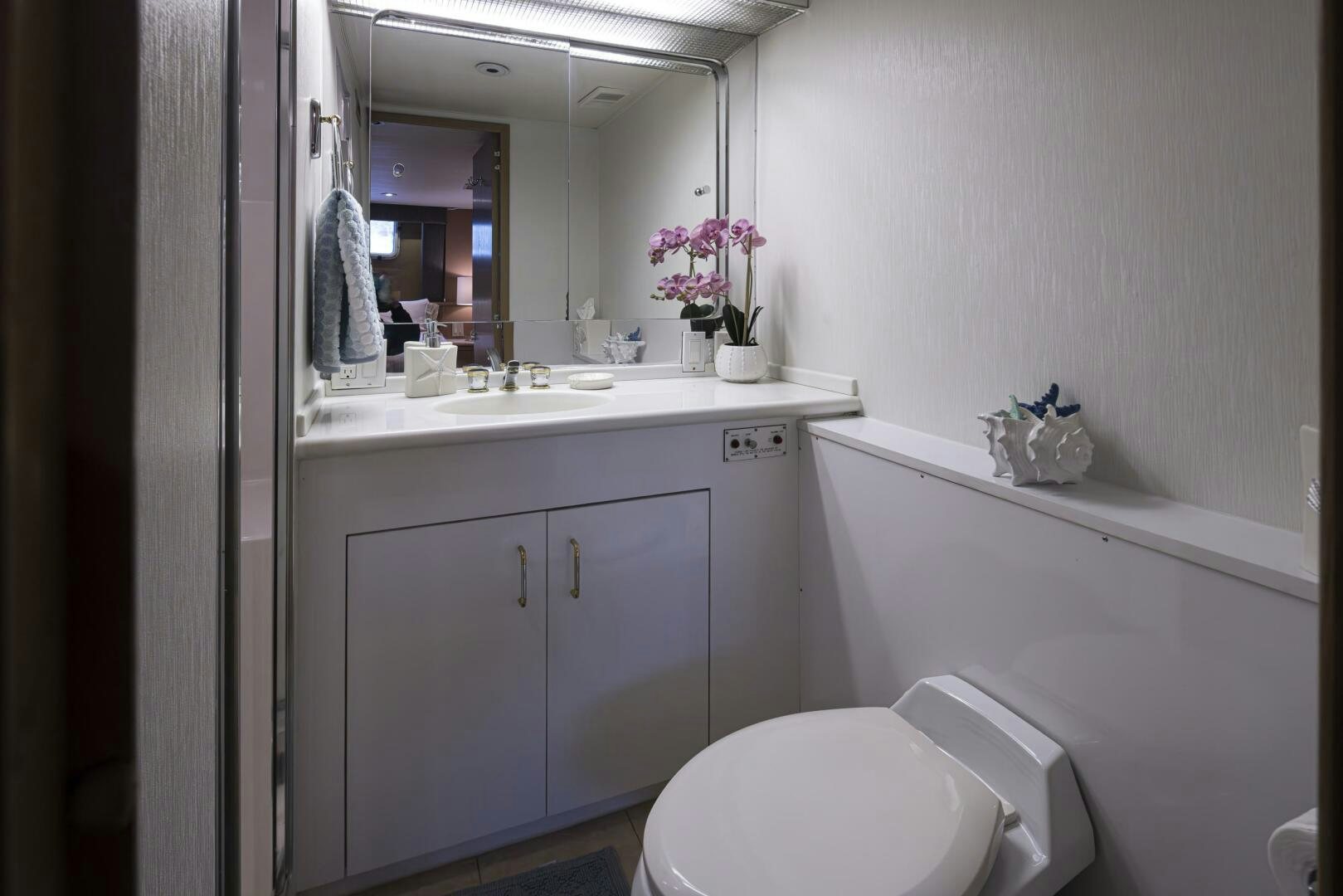 a bathroom with a sink and toilet aboard LISA SEA I Yacht for Sale