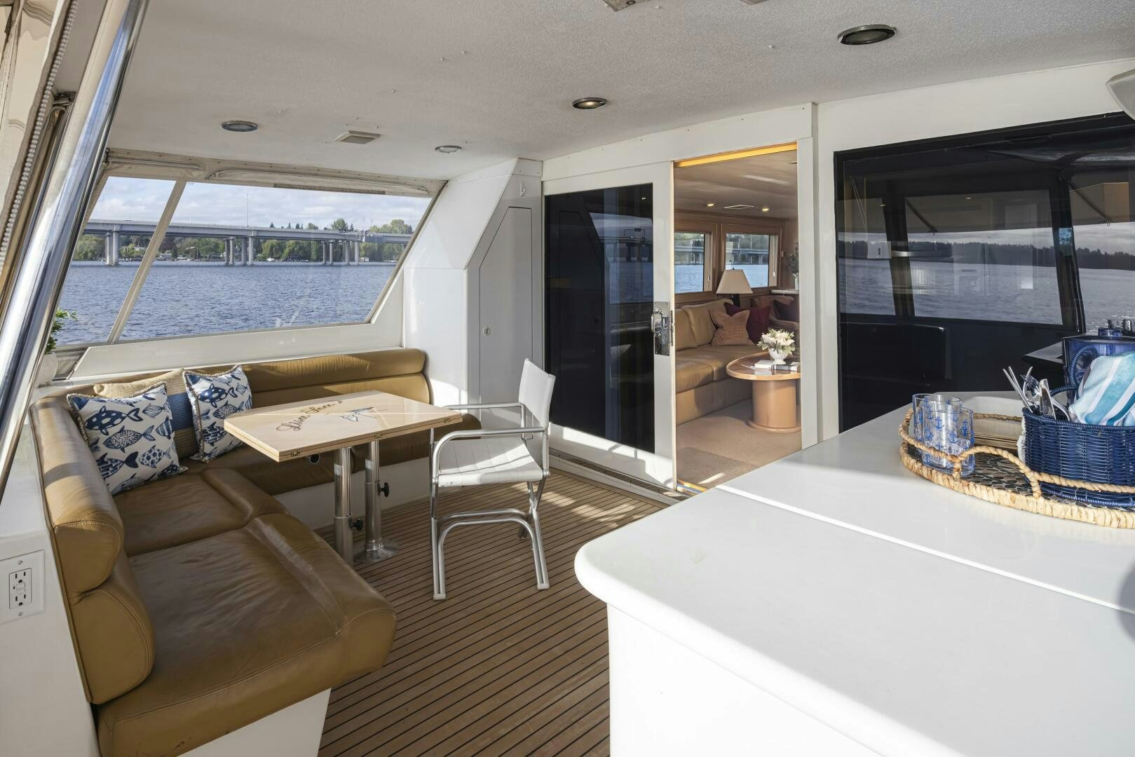 a living room with a large window aboard LISA SEA I Yacht for Sale