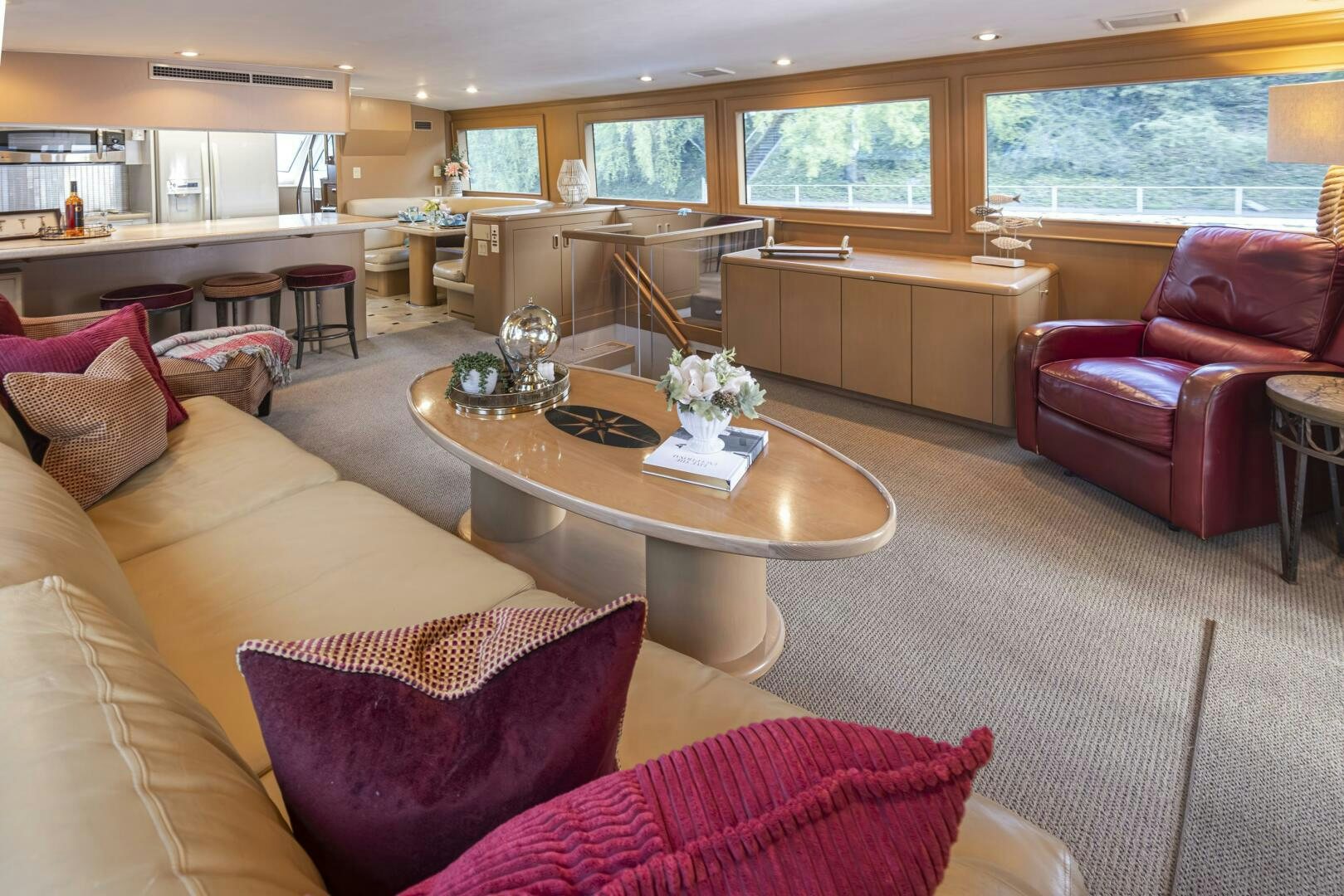 a living room with a table and chairs aboard LISA SEA I Yacht for Sale