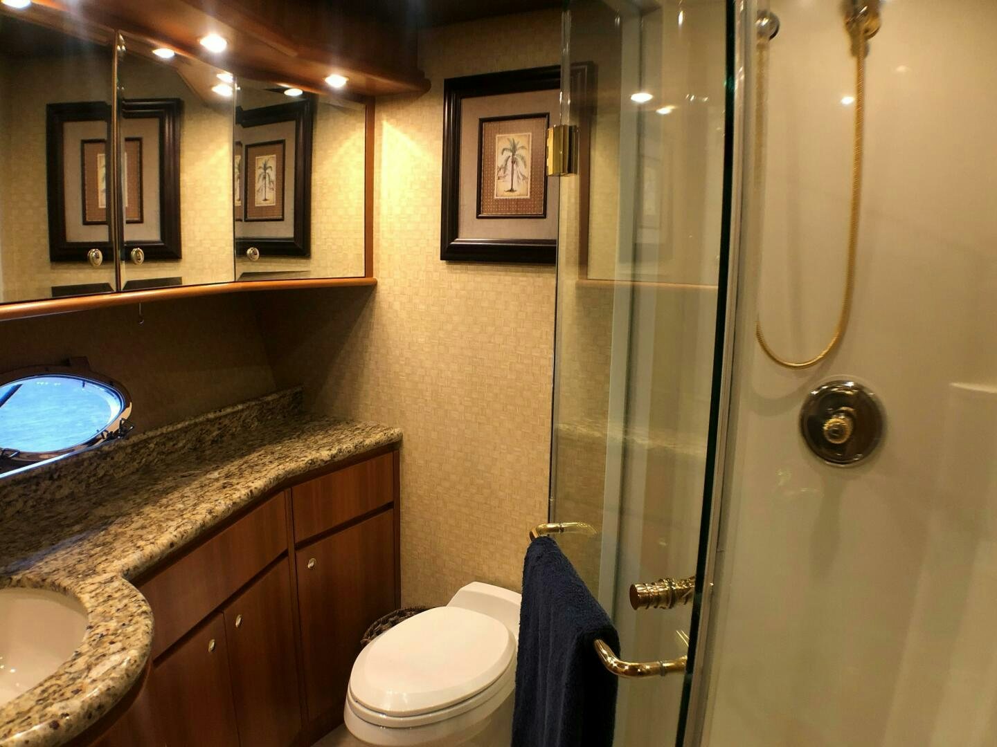 a bathroom with a glass shower aboard ENCHANTRESS Yacht for Sale