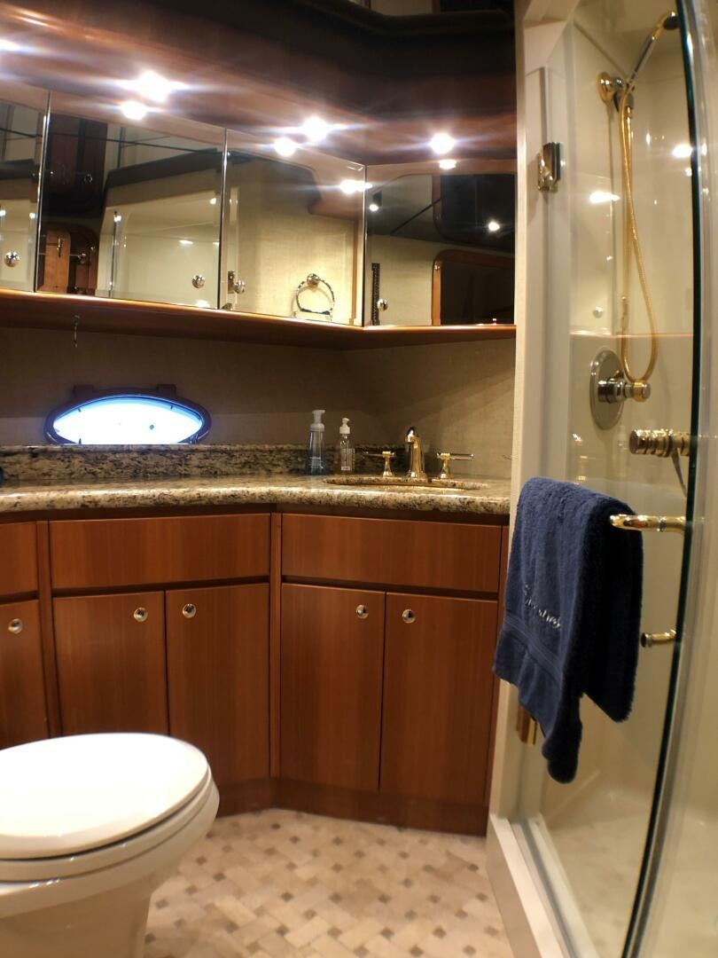 a bathroom with a large mirror aboard ENCHANTRESS Yacht for Sale