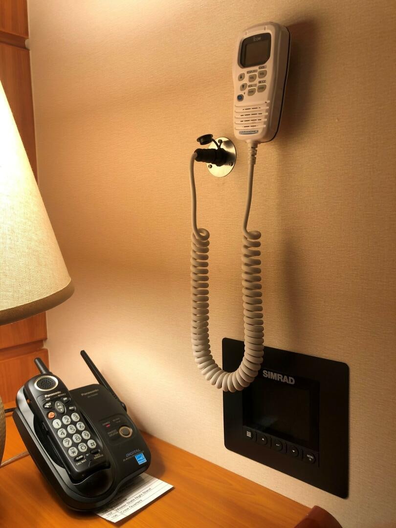 a telephone and a charger aboard ENCHANTRESS Yacht for Sale