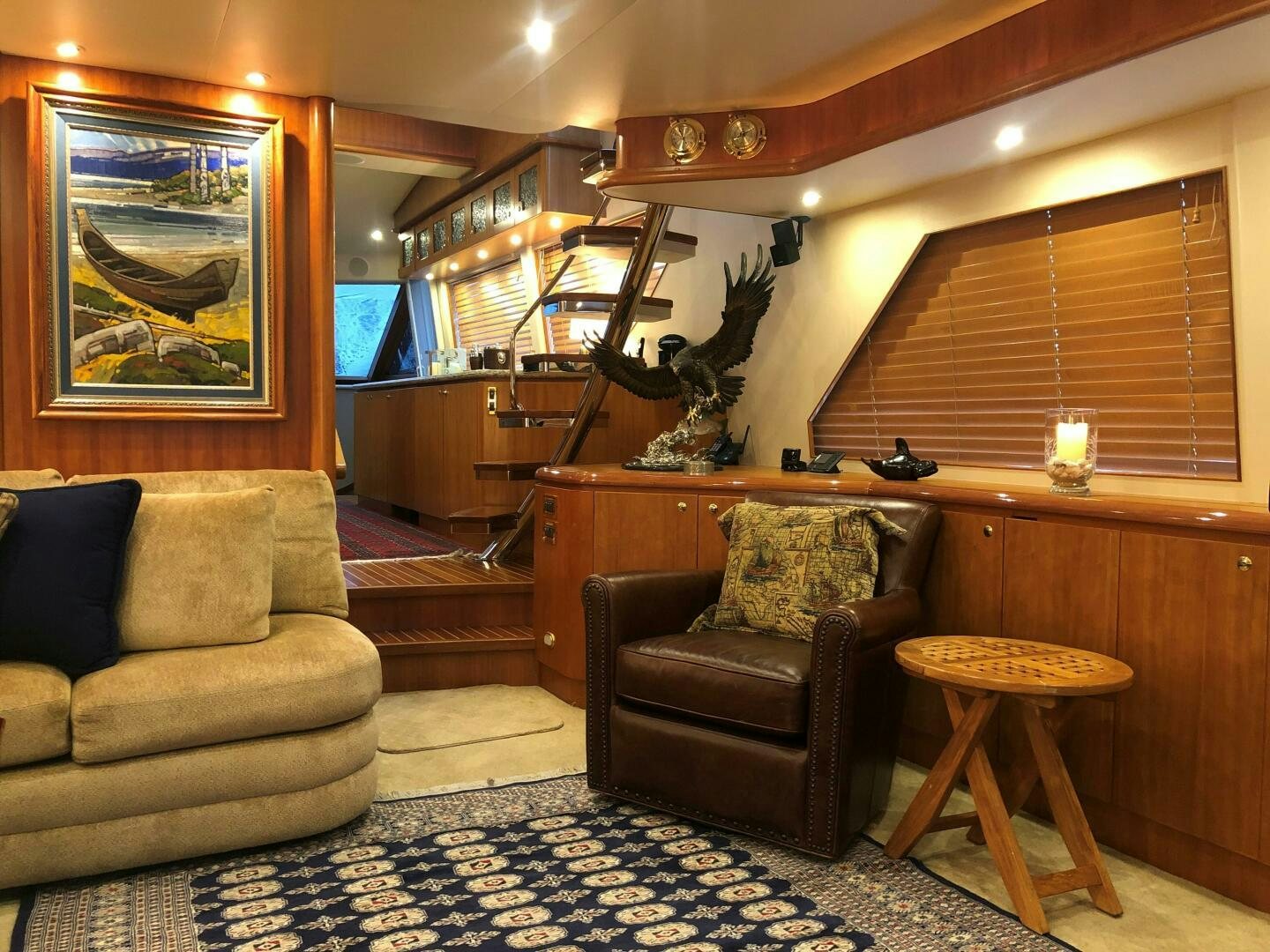 a living room with a piano and a piano aboard ENCHANTRESS Yacht for Sale