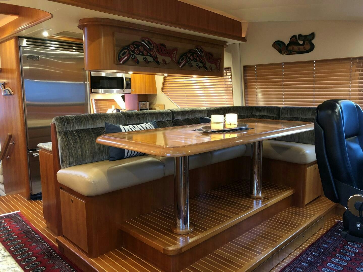 a table and chairs in a room aboard ENCHANTRESS Yacht for Sale