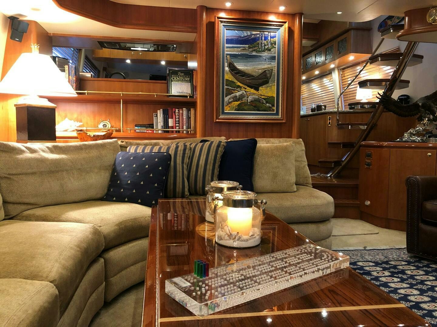 a living room with a couch and a coffee table aboard ENCHANTRESS Yacht for Sale