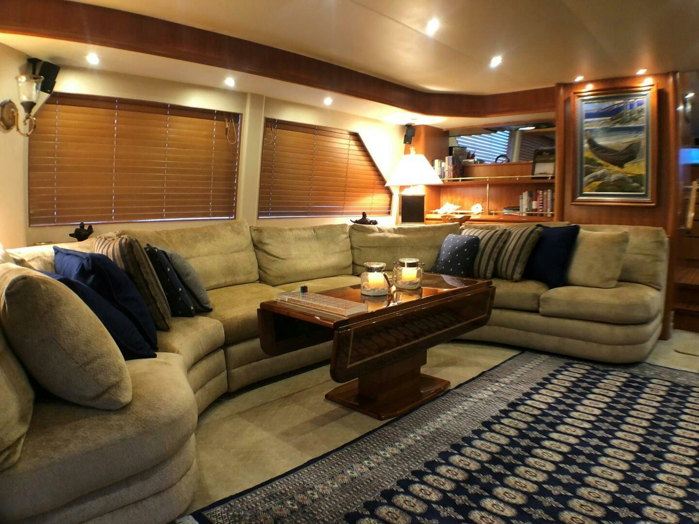 a living room with a couch and a coffee table aboard ENCHANTRESS Yacht for Sale
