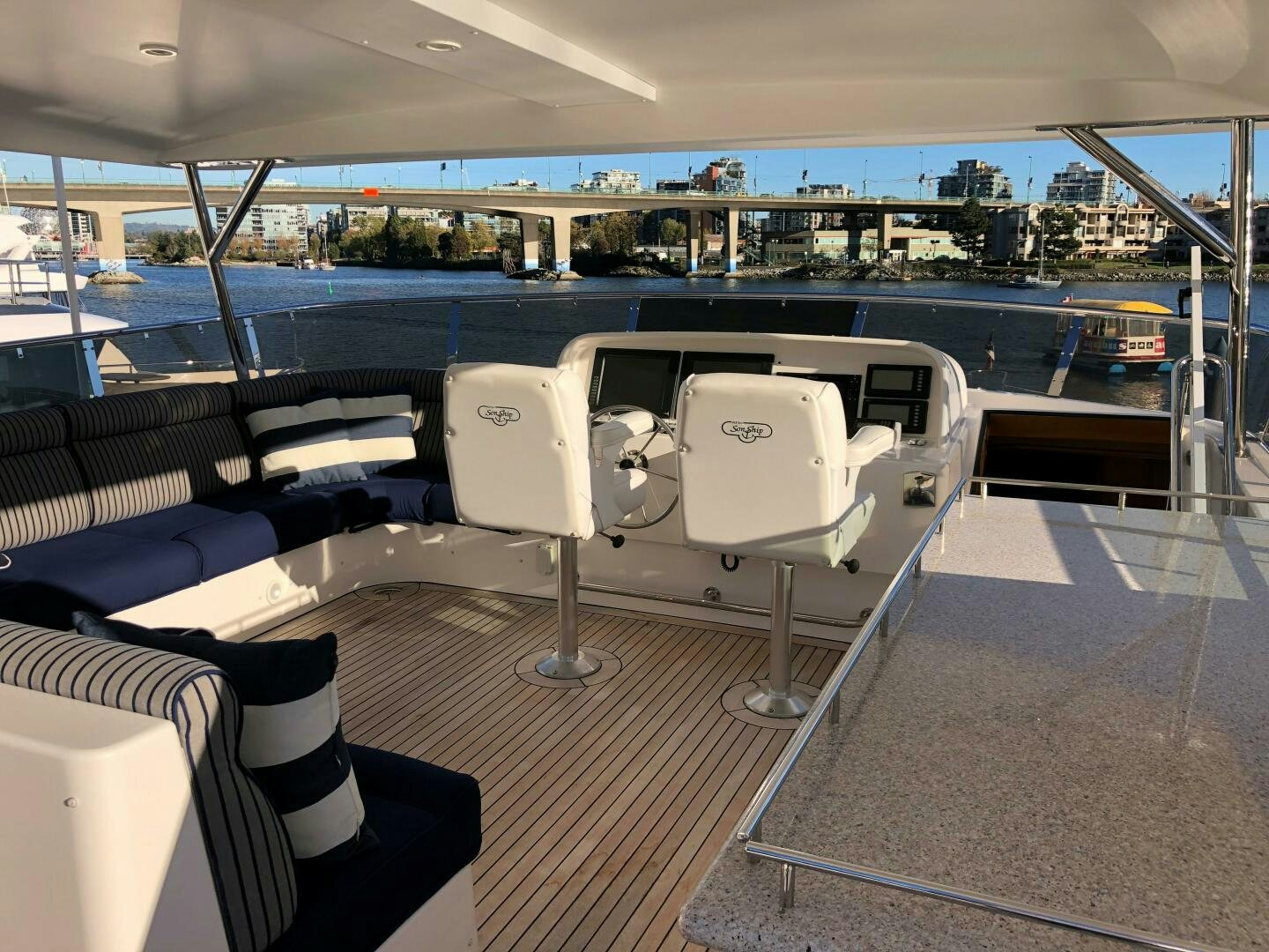 a boat deck with chairs and tables aboard ENCHANTRESS Yacht for Sale