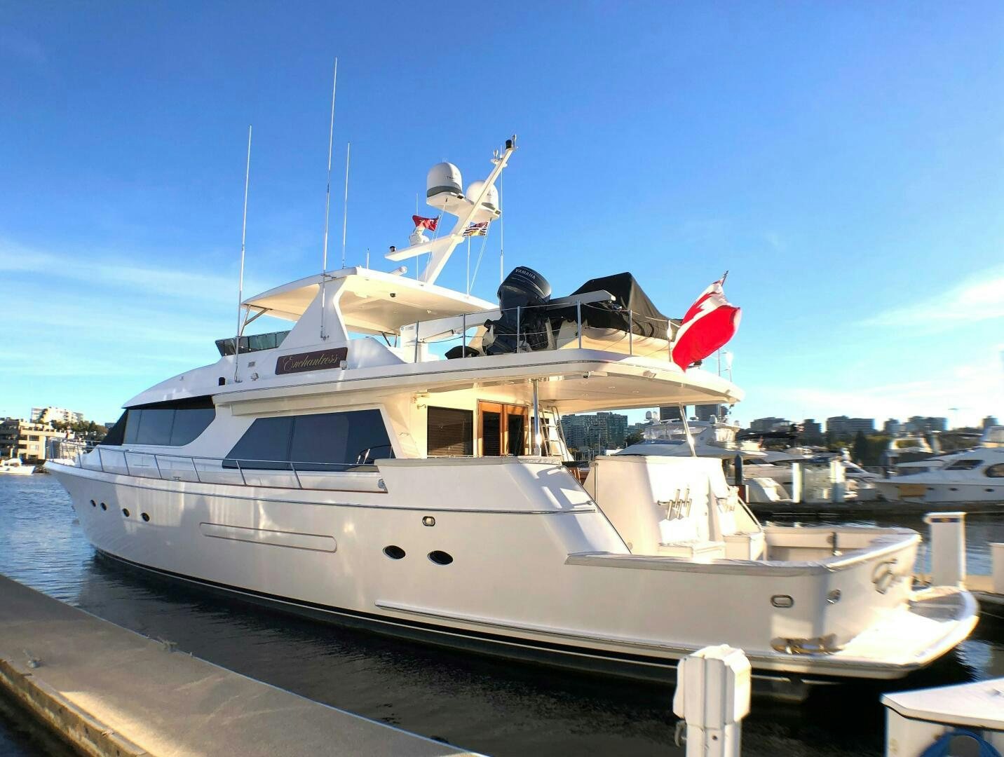 a boat docked at a pier aboard ENCHANTRESS Yacht for Sale