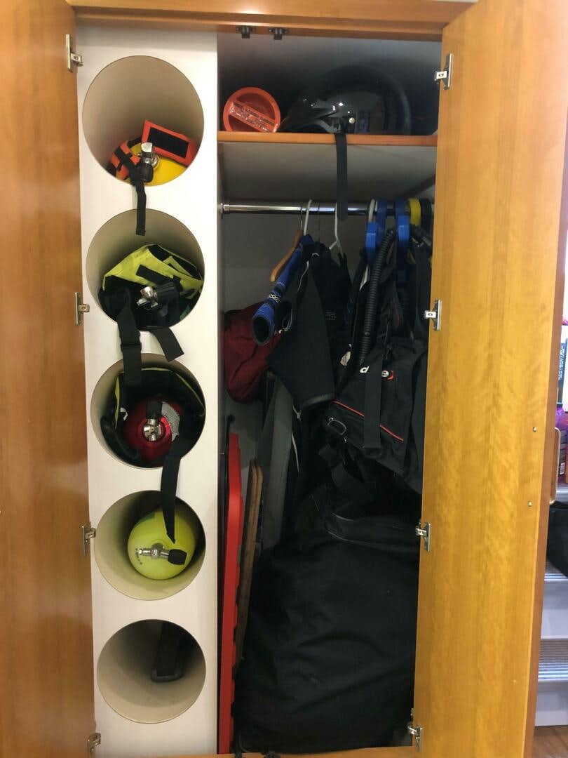a closet full of clothes aboard ENCHANTRESS Yacht for Sale