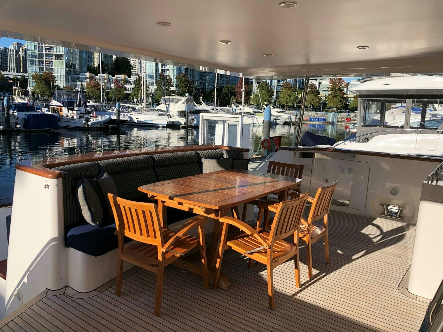 a table and chairs on a deck aboard ENCHANTRESS Yacht for Sale