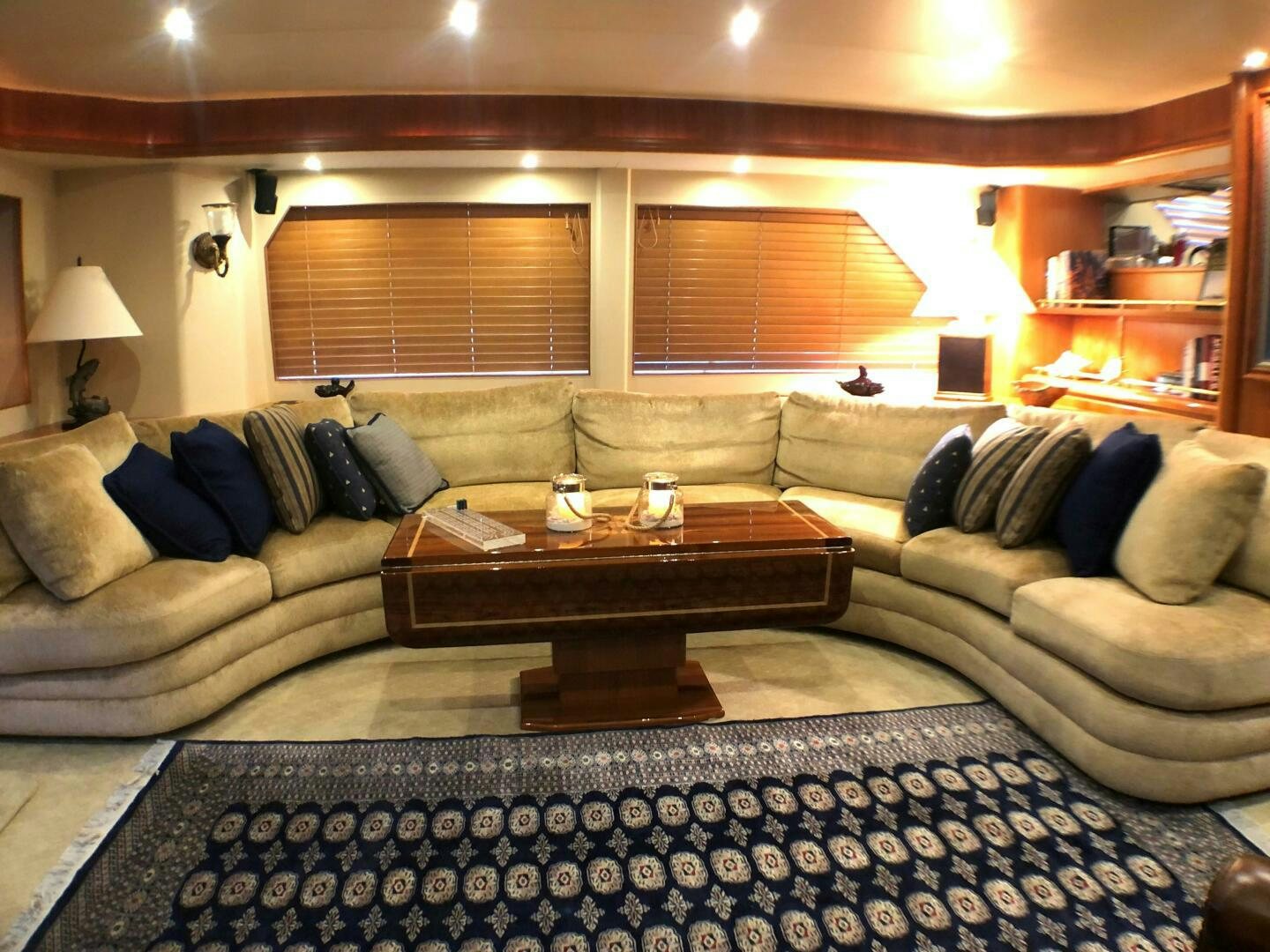 a living room with a couch and a coffee table aboard ENCHANTRESS Yacht for Sale
