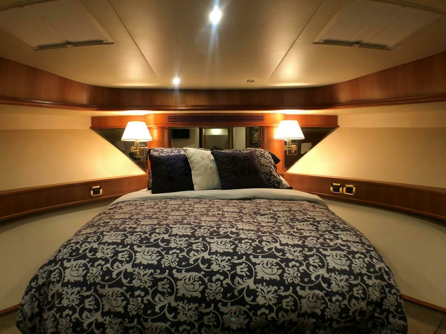 a bed with pillows and pillows aboard ENCHANTRESS Yacht for Sale