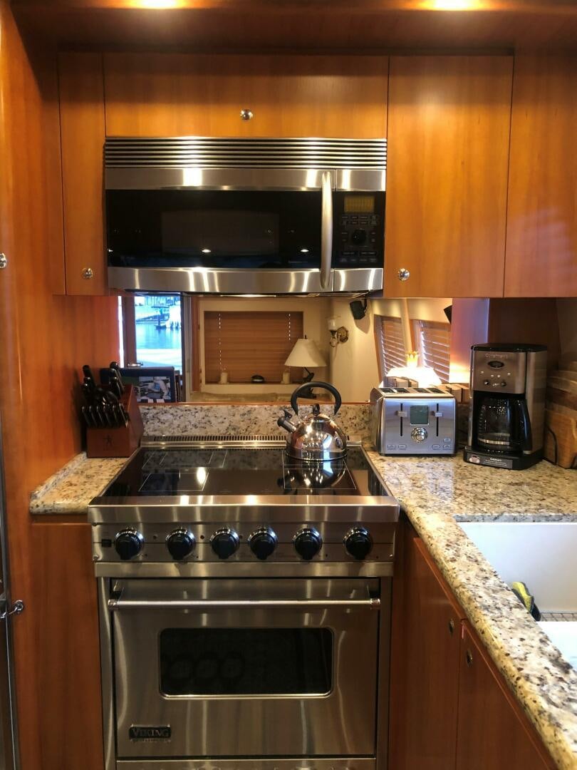 a kitchen with a stove and oven aboard ENCHANTRESS Yacht for Sale