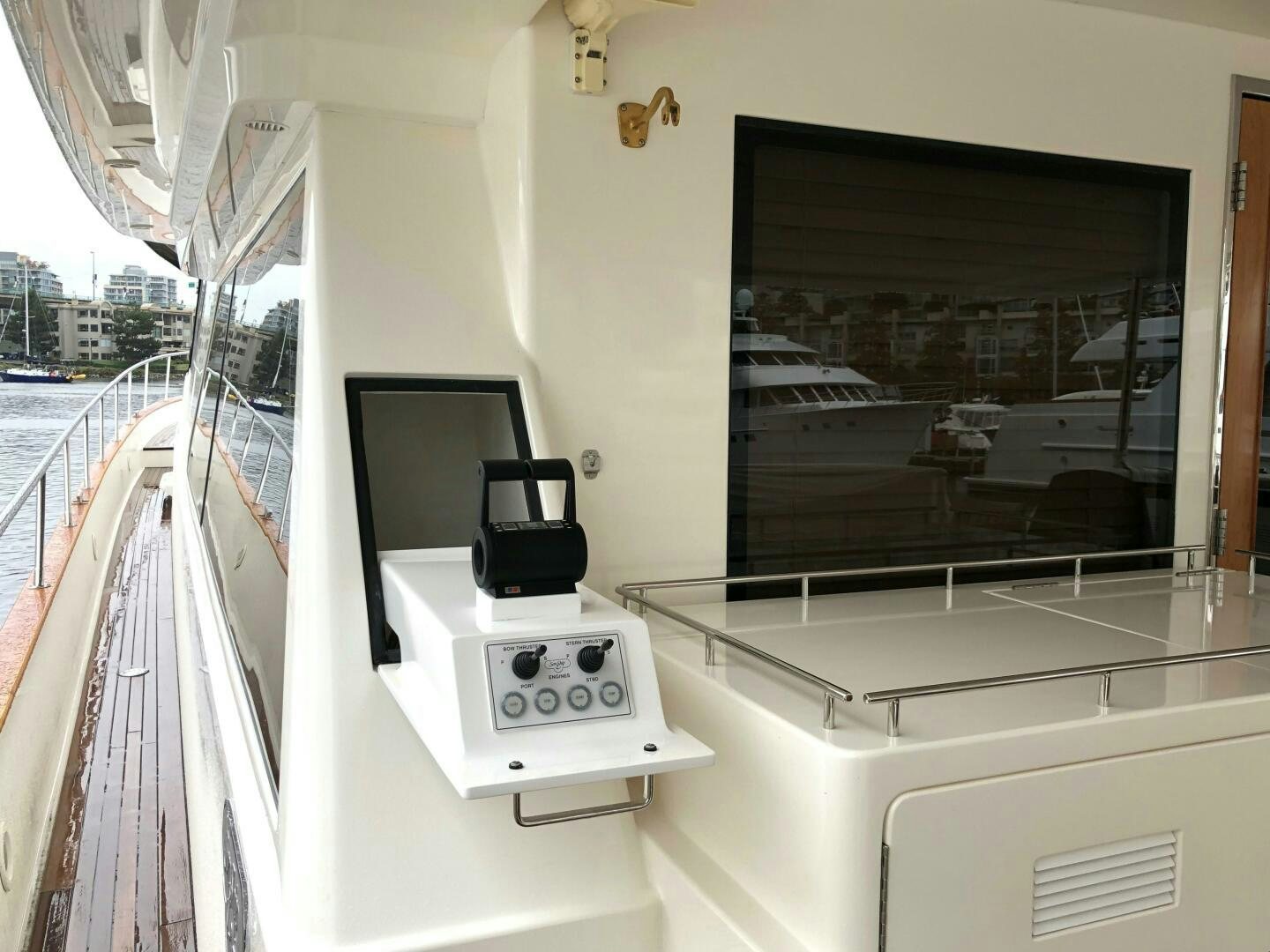 a white machine on a balcony aboard ENCHANTRESS Yacht for Sale