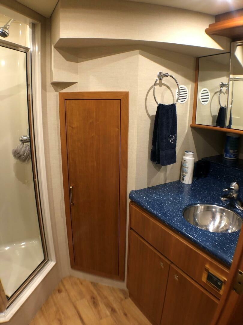 a bathroom with a sink and a mirror aboard ENCHANTRESS Yacht for Sale