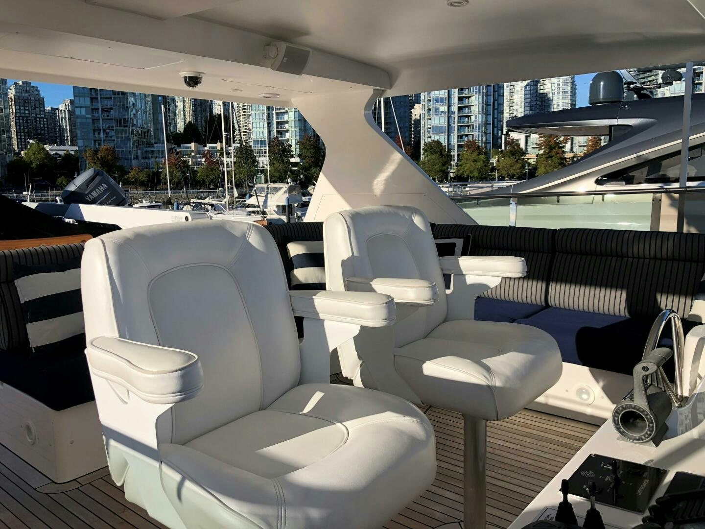 a room with a view of a city and a large window aboard ENCHANTRESS Yacht for Sale