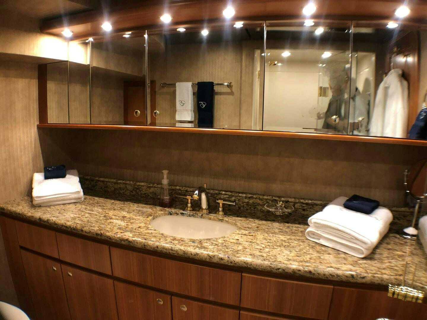 a bathroom with a large mirror aboard ENCHANTRESS Yacht for Sale