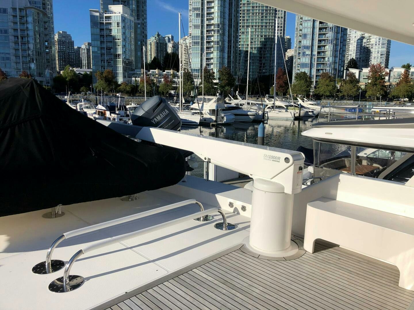 a large black object on a white surface with a city in the background aboard ENCHANTRESS Yacht for Sale