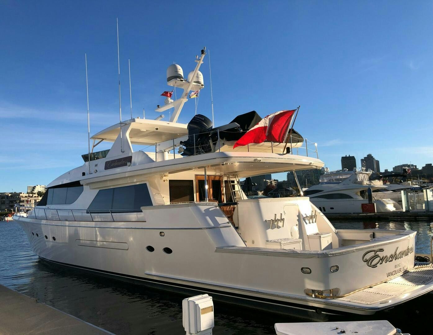 a boat with a flag on the front aboard ENCHANTRESS Yacht for Sale