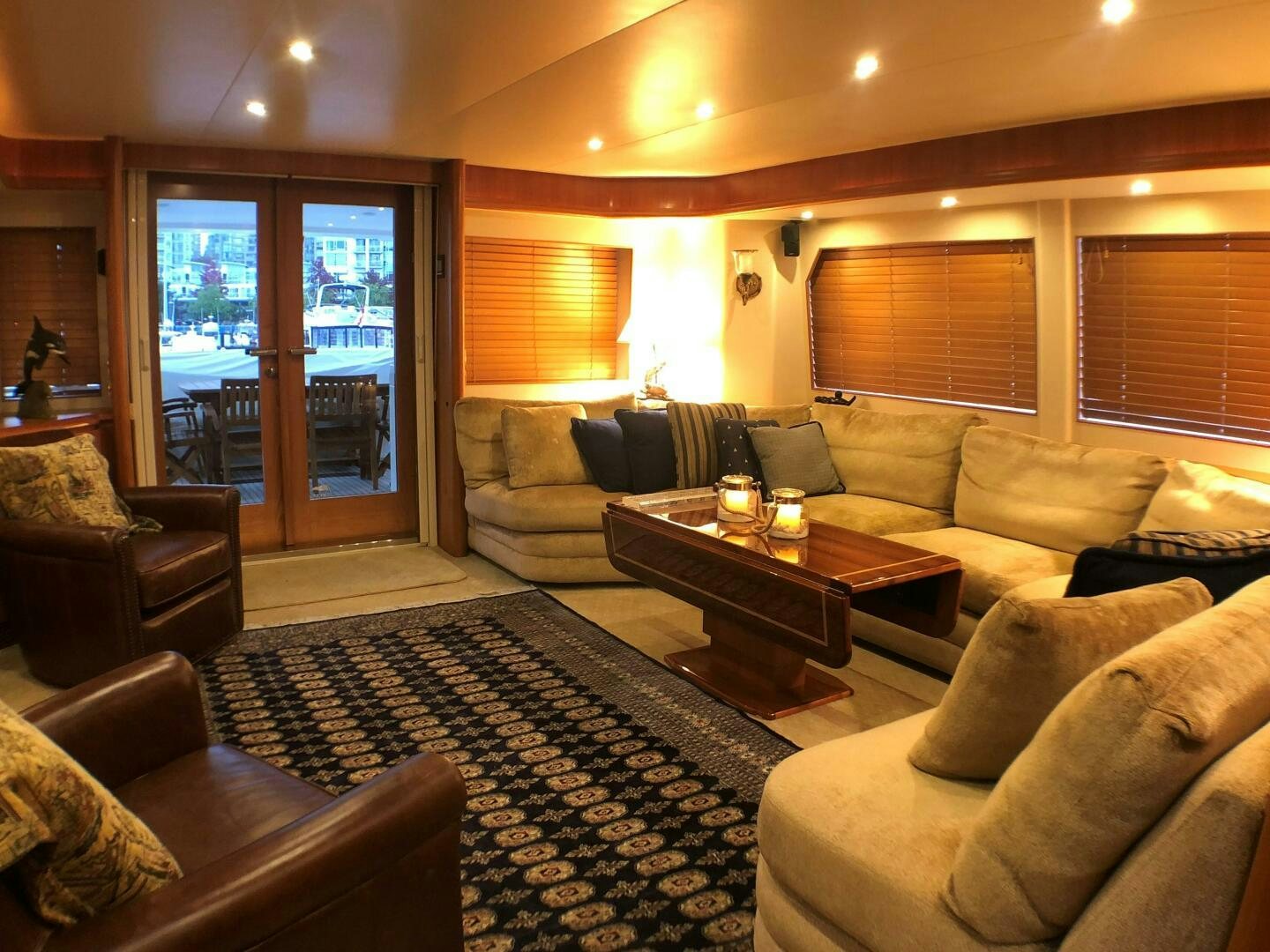 a living room with a rug and couches aboard ENCHANTRESS Yacht for Sale