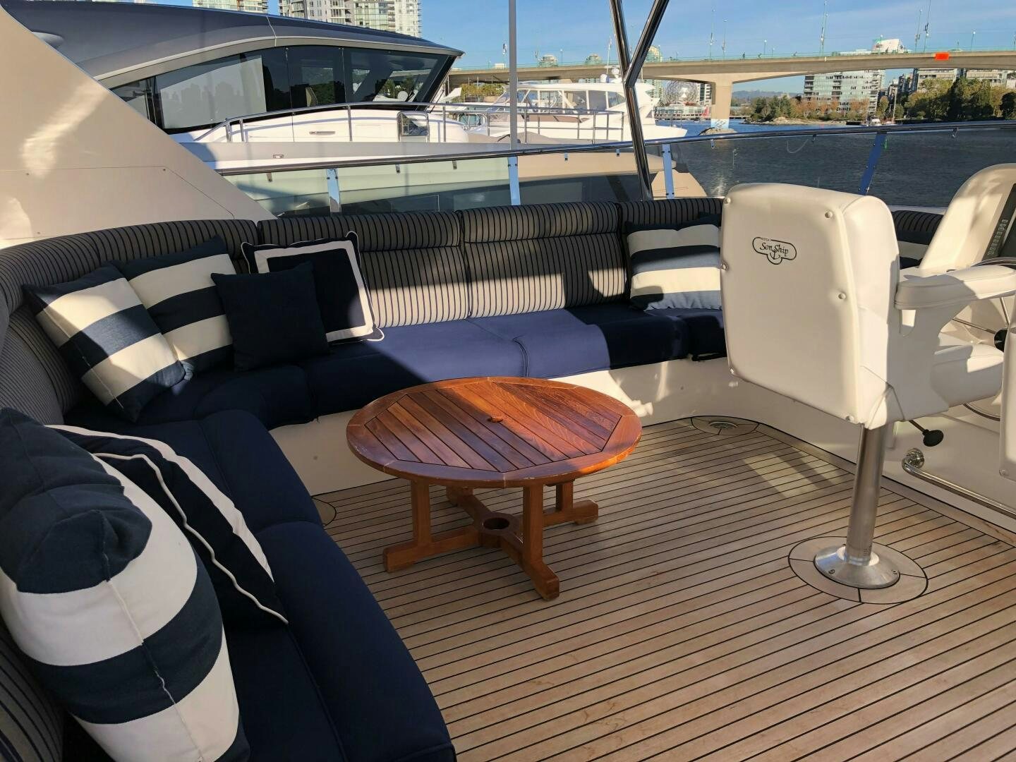 a table and chairs on a deck aboard ENCHANTRESS Yacht for Sale