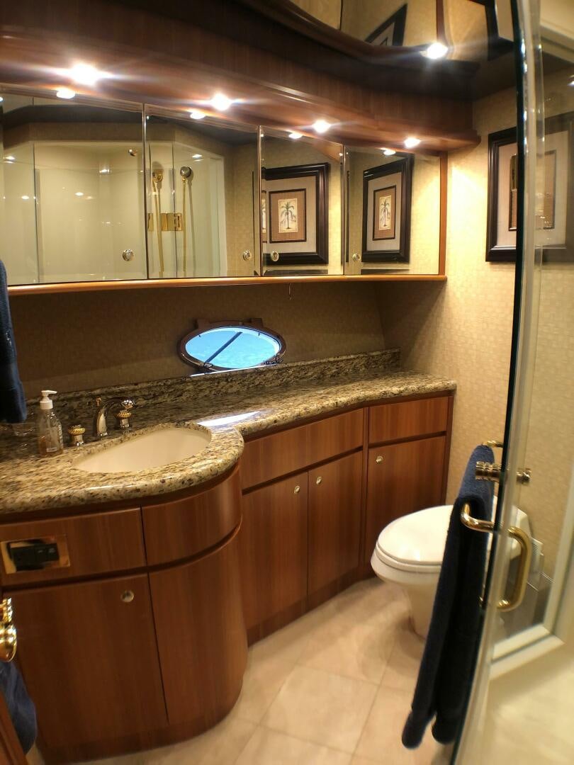 a bathroom with a sink and a toilet aboard ENCHANTRESS Yacht for Sale