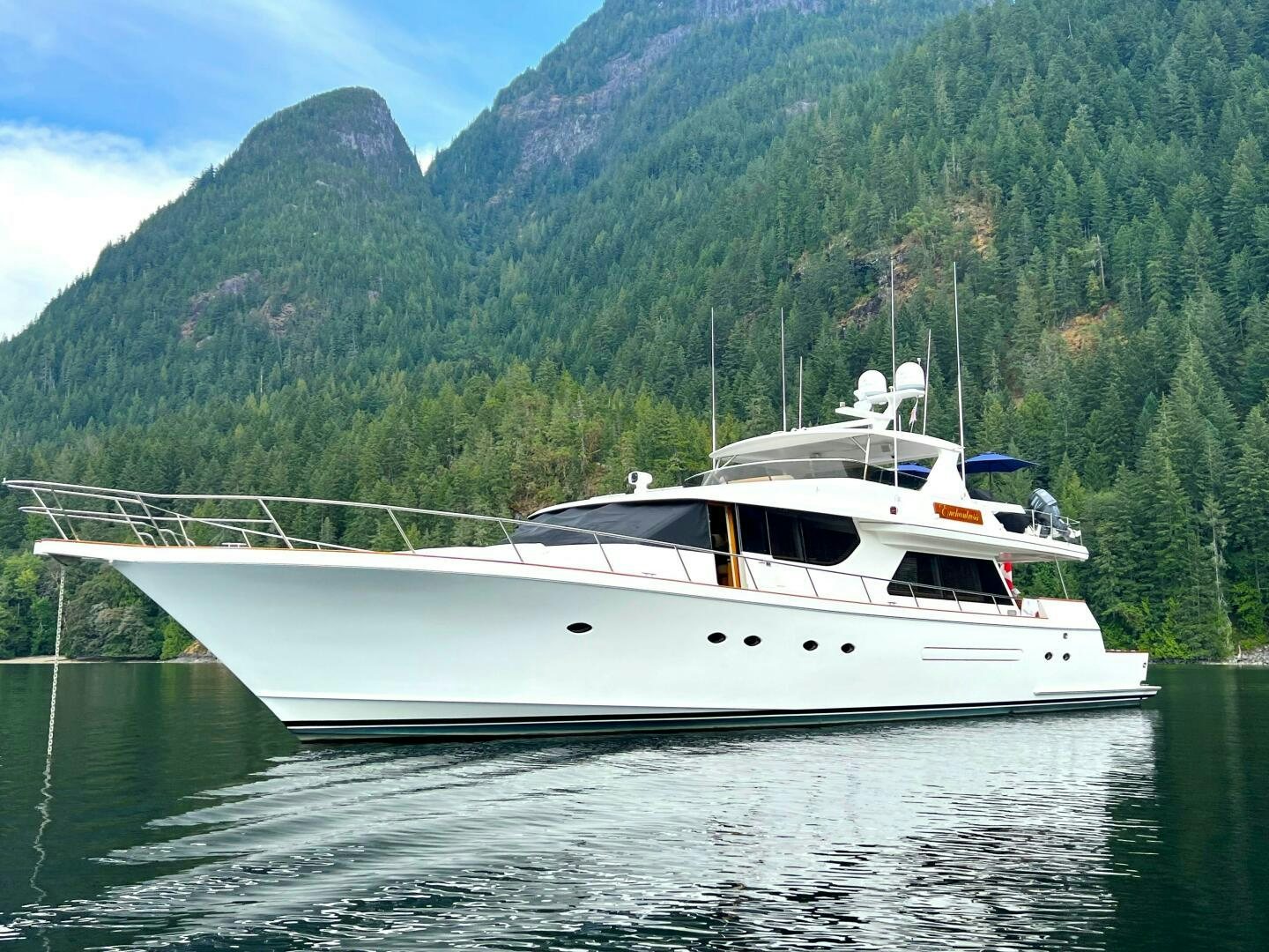 a white yacht in the water aboard ENCHANTRESS Yacht for Sale