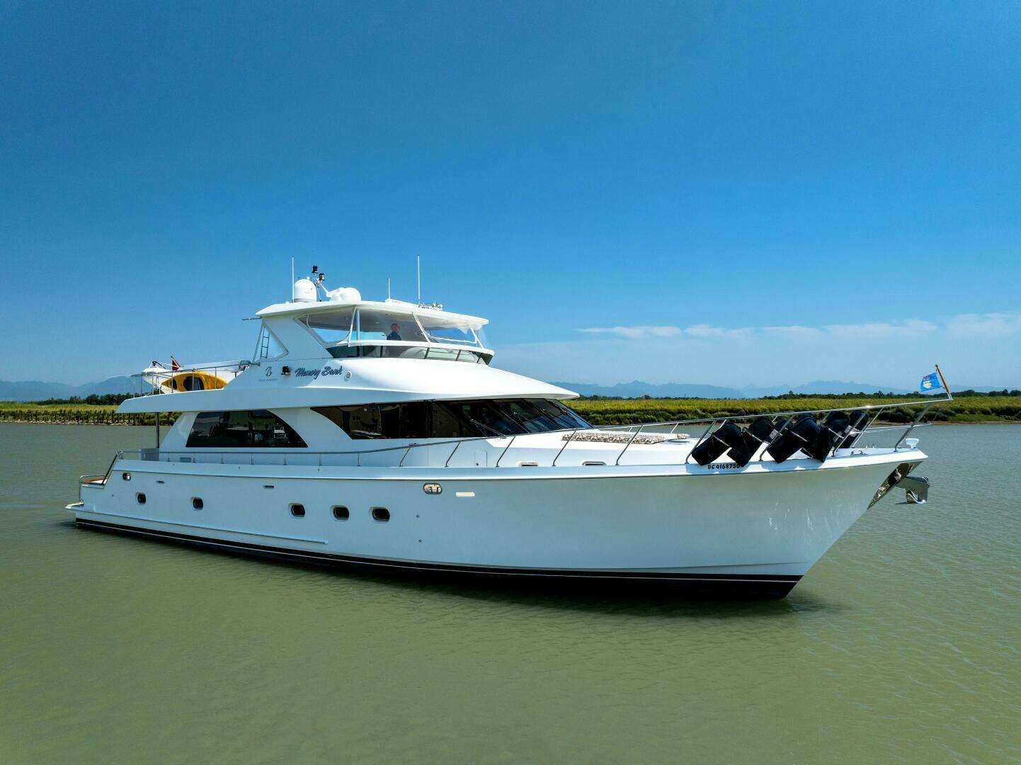 a white yacht in the water aboard MEMORY BANK Yacht for Sale