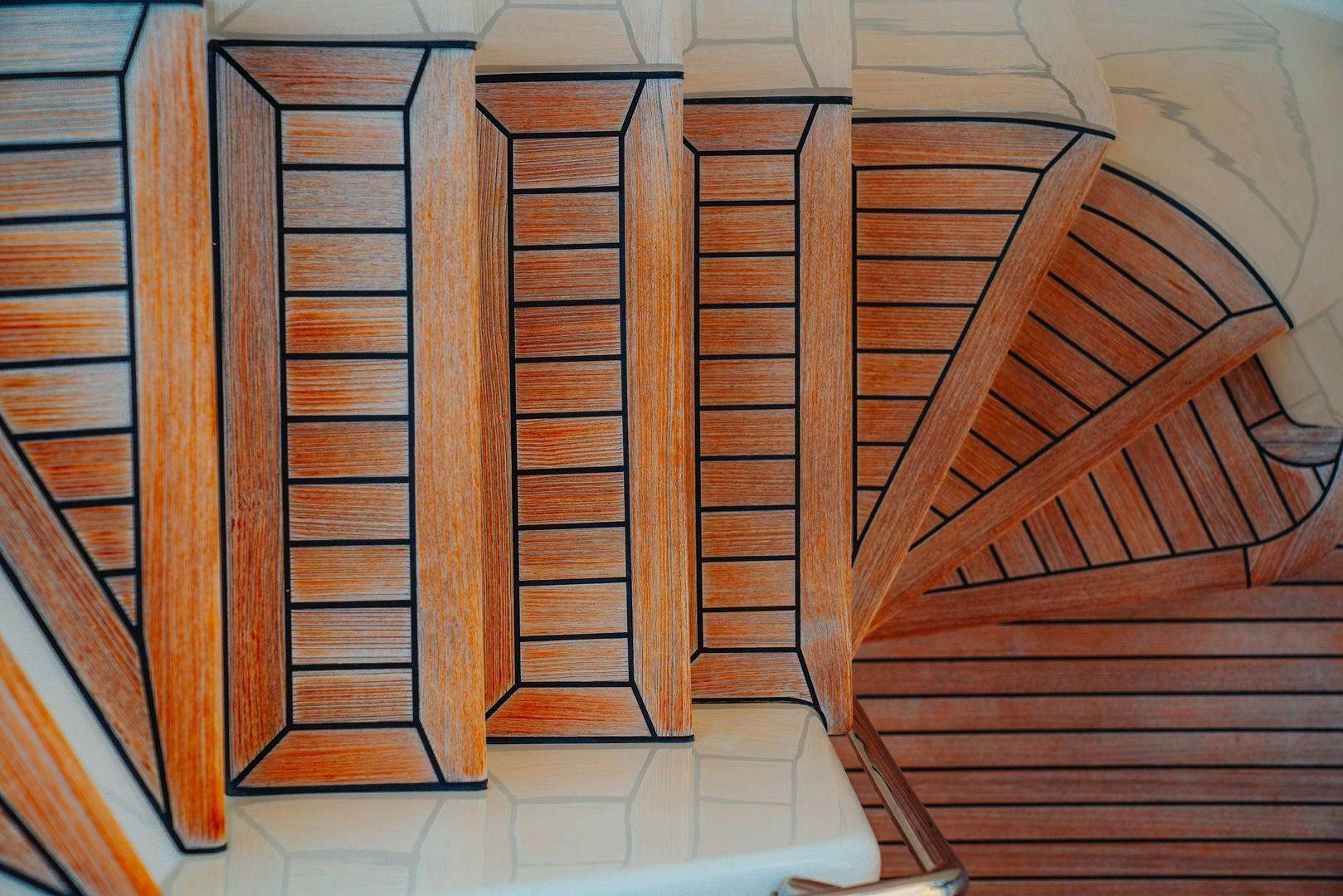 a set of wooden stairs aboard LOS ESQUINKLES Yacht for Sale
